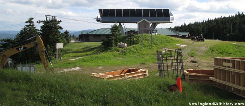 Forms and rebar for the new lift with its predecessor in the background in July 2014