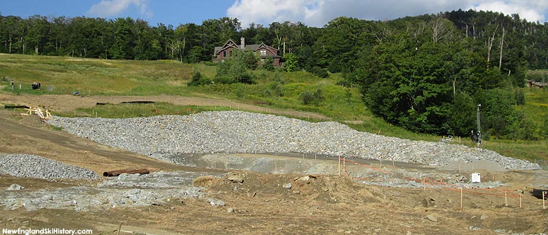 Excavation of the bottom terminal location (right) and tower footings (left) (September 2014)