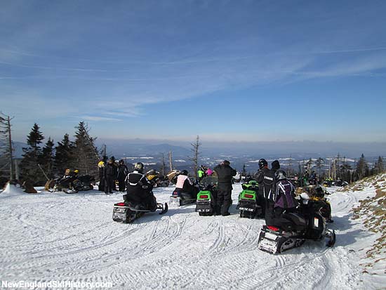 Snowmobilers looking west from below the summit of Dixville Peak (2014)